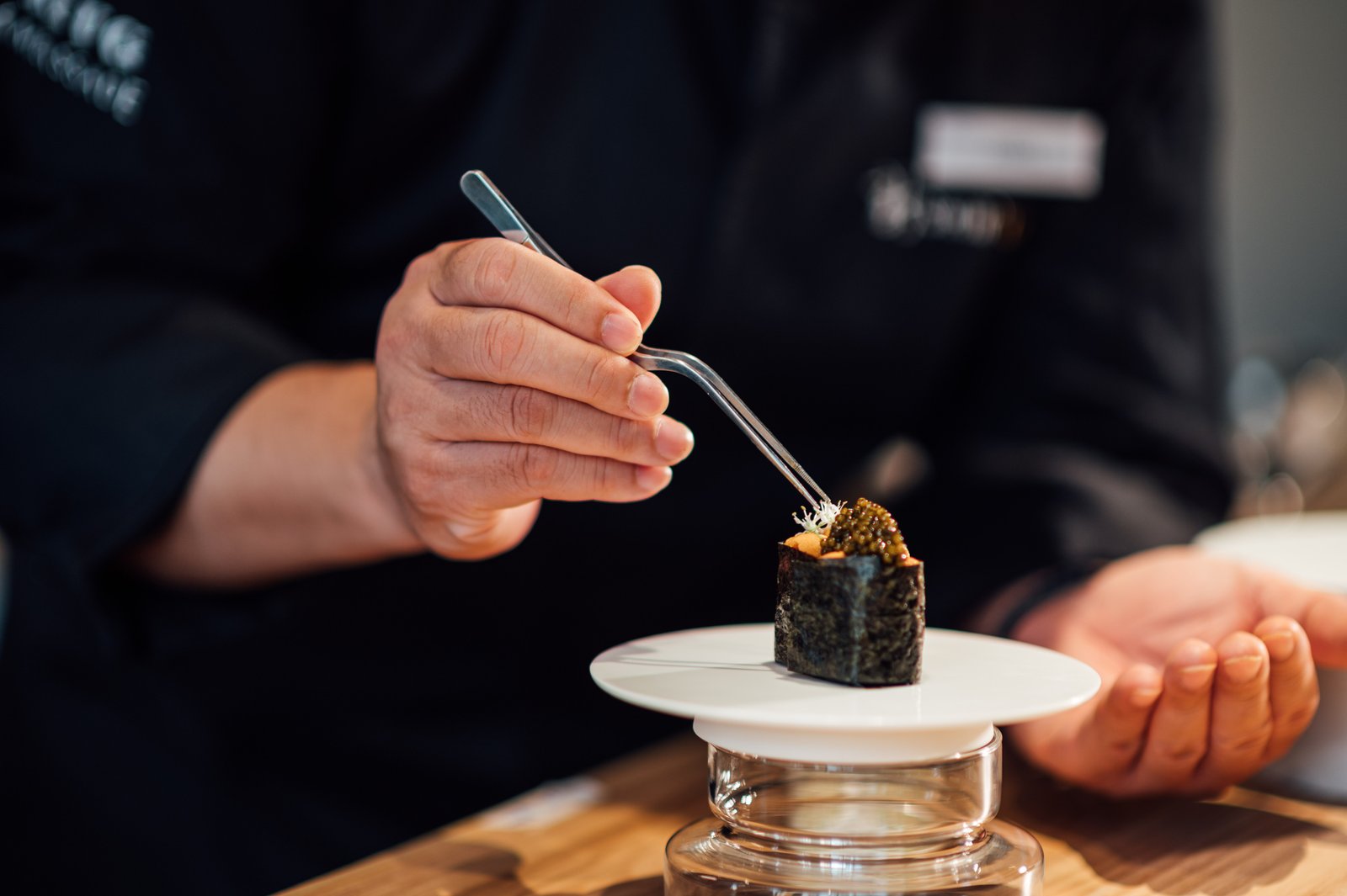 The hands at work — patience as the practice underneath the dish.