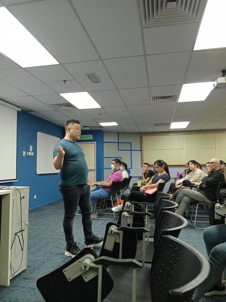 James Won lecturing to a seated class at Taylor's