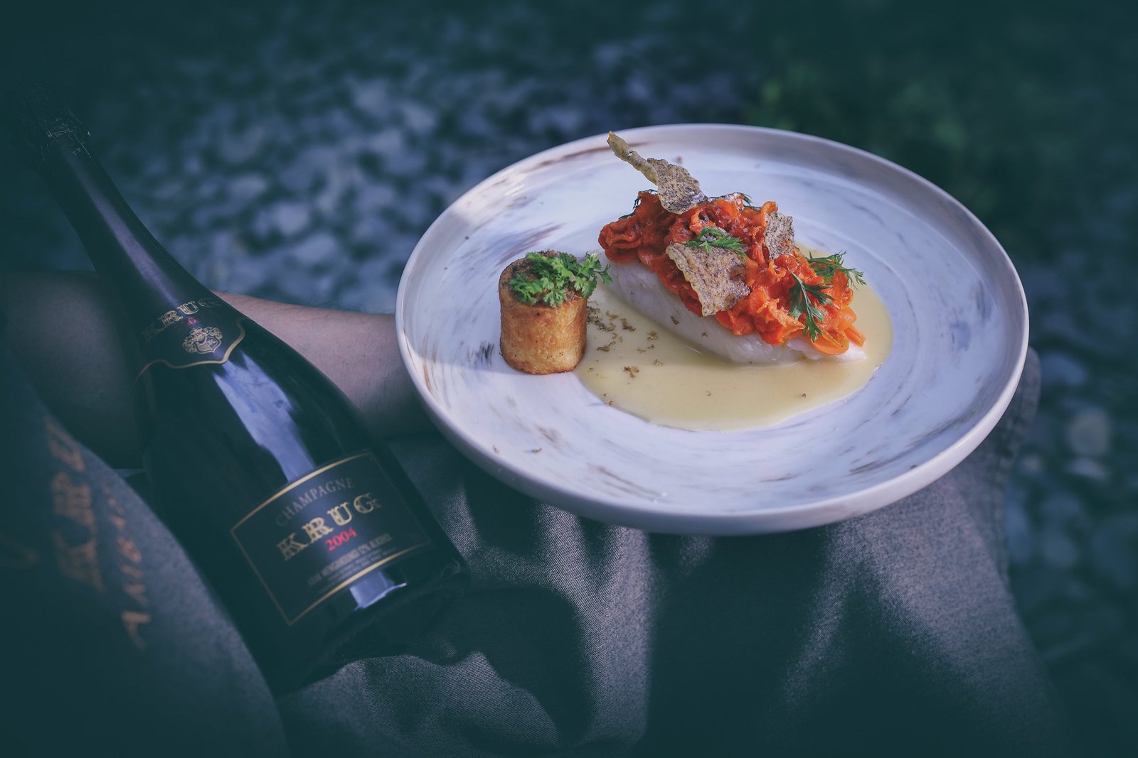 Krug Degustation course four — river fish, carrot chips, shaved mushrooms, fermented carrot jus emulsion, potato fondant farci of fish Taramasalata.