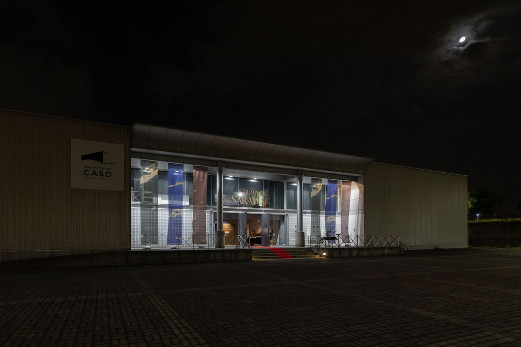 Seaside Studio CASO lit at night