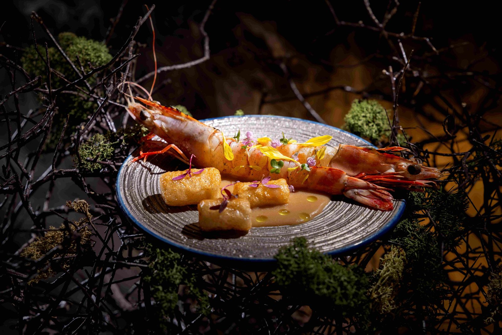 Sarawak tiger prawn wrapped in daun bungkang, hearth-roasted.