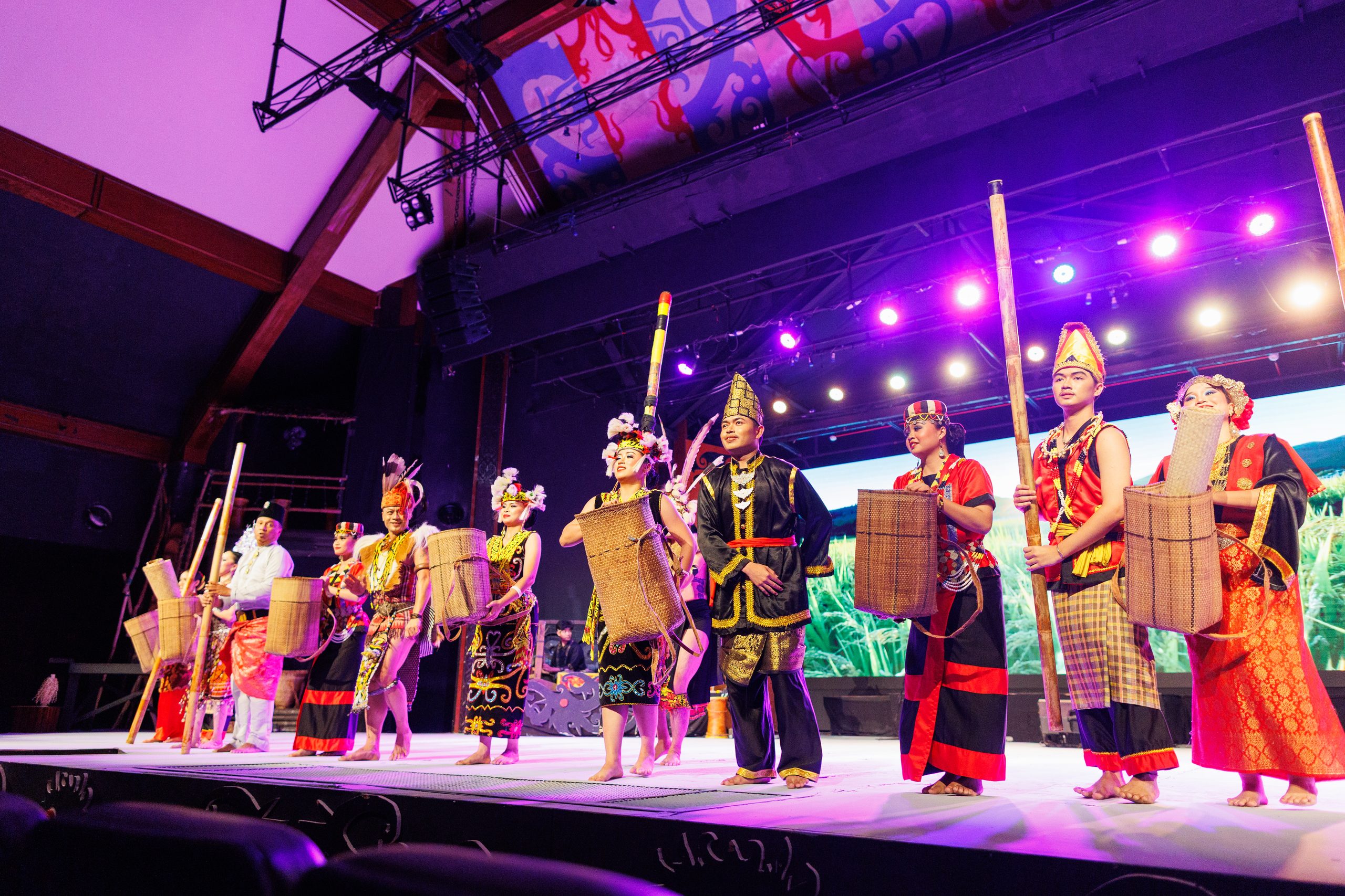 Performers in the dress of Sarawak's communities on stage at Sarawak Cultural Village.