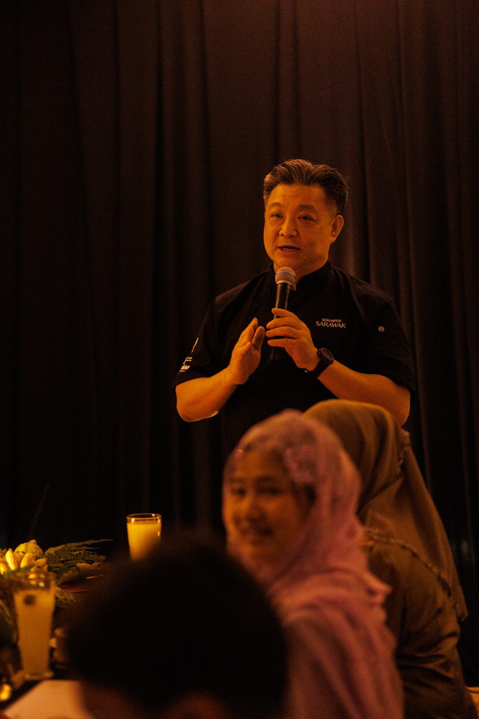 Speaking to the guests in the dining room